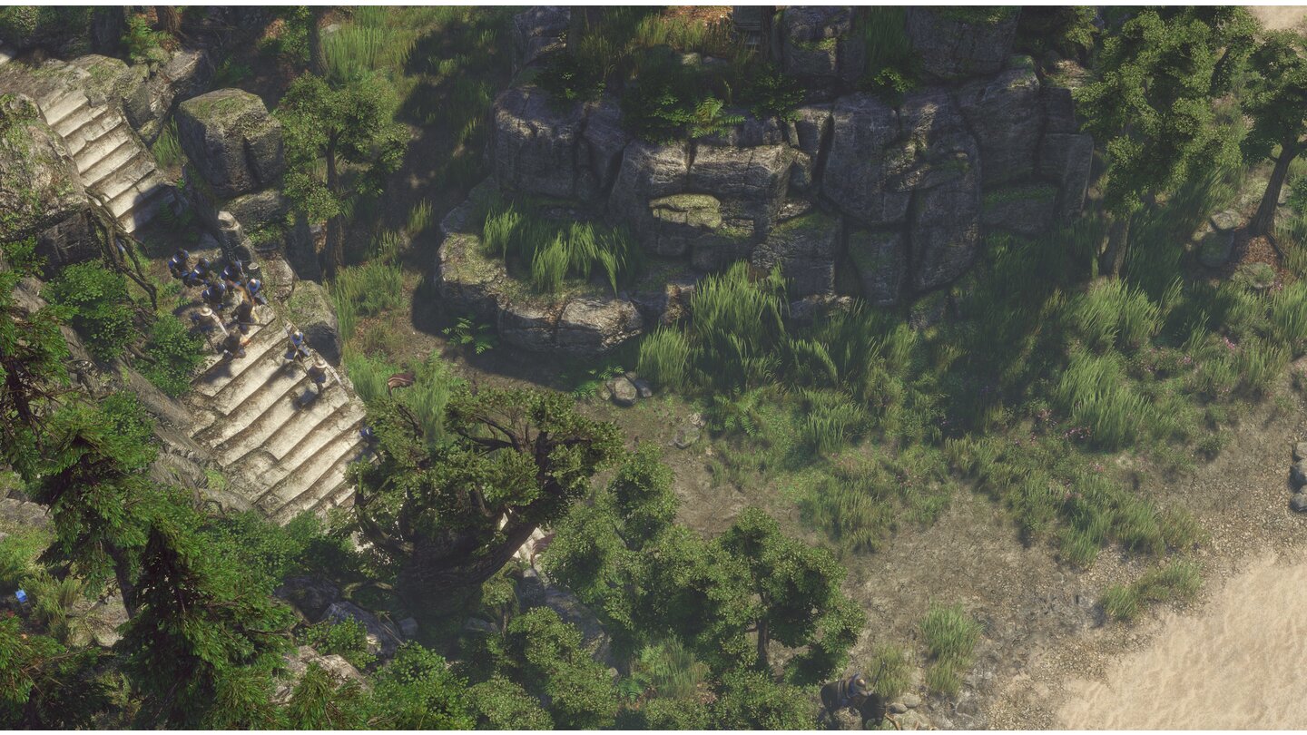 Spellforce 3Ein kleiner Stoßtrupp stürmt die Stufen ins grüne Tal hinab. Im fertige Spiel soll es vier Klimazonen geben: Wald, Wüste, Dschungel und Vulkanlandschaften.