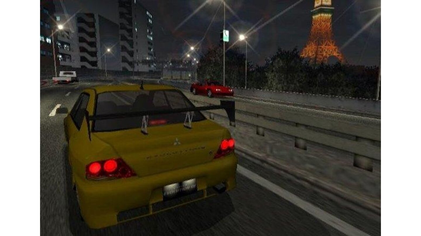 Evo 7 crusing past the Tokyo Tower