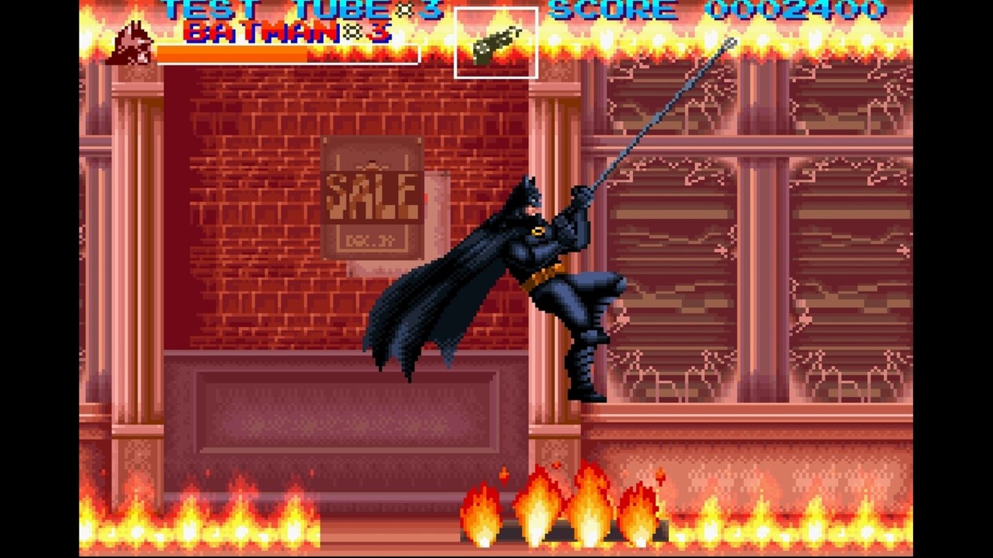 Batman ReturnsDie Kulisse geht in Flammen auf, doch Batman bleibt cool und greift zum Haken. Mit solchen Jump&Run-Abschnitten lockern die Entwickler das Spielgeschehen auf.