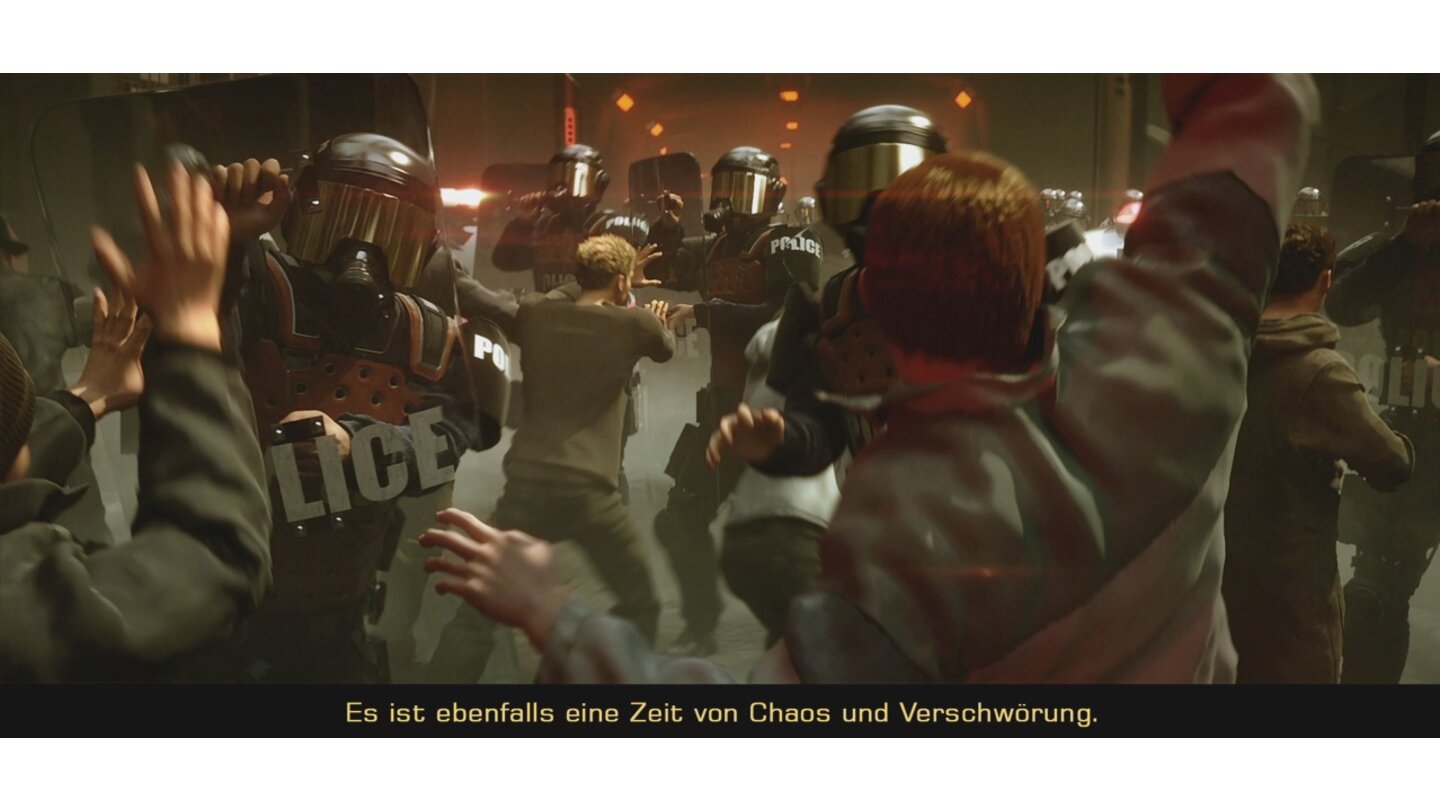 [16] Deus Ex: Human Revolution spielt in unruhigen Zeiten, die Kybernetik führt zu einer Zwei-Klassen-Gesellschaft. Der Trailer zeigt eine Demonstration gegen die künstliche Verbesserung von Menschen.