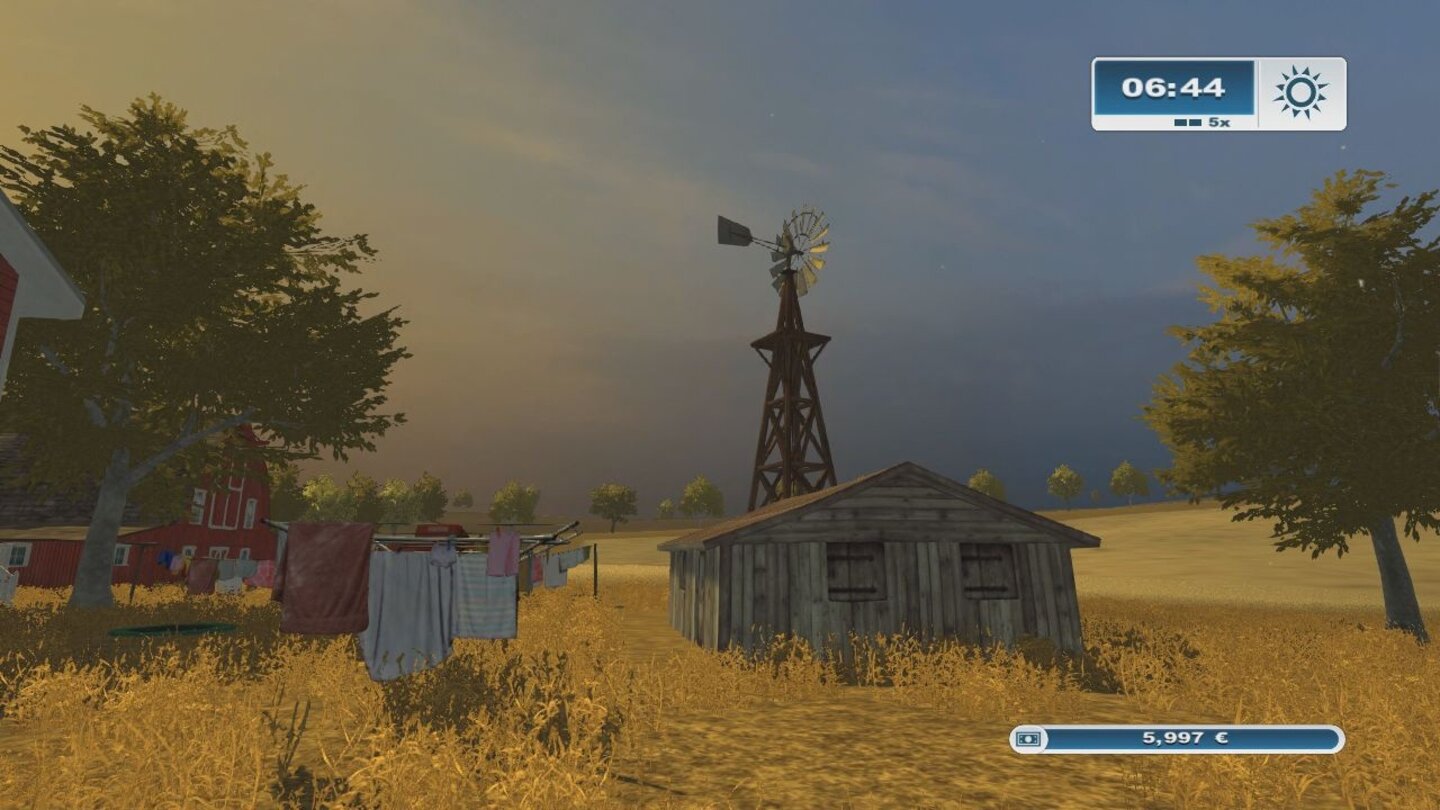 Landwirtschafts-Simulator 2013 - Screenshots aus der KonsolenversionDetails wie hier das Windrad oder die reichlich platzierten amerikanischen Flaggen hauchen der Westbridge Hills zumindest etwas Leben ein.