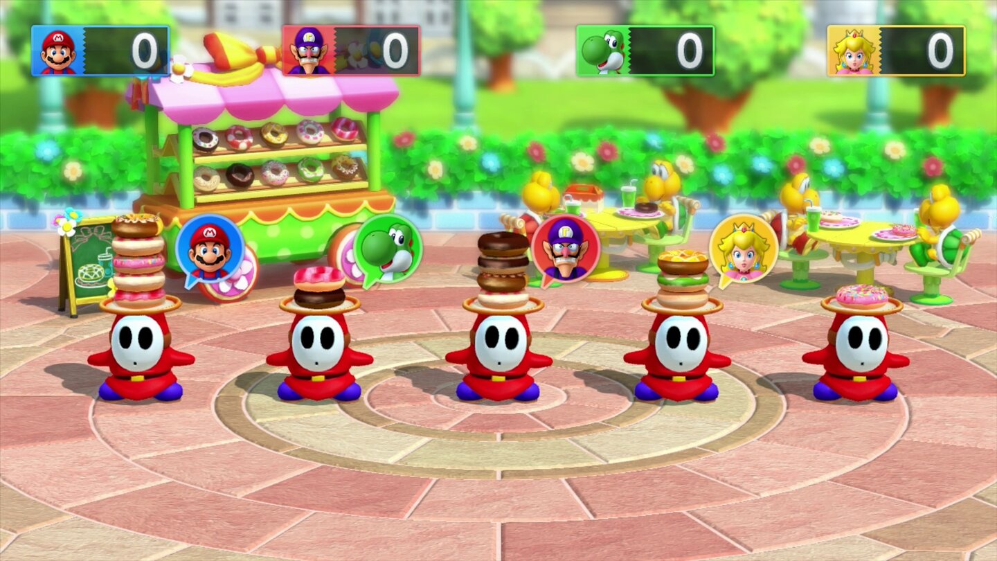 Mario Party 10In diesem Minispiel müssen wir uns den Shy Guy merken, der die meisten Donuts unter der Mütze hat.