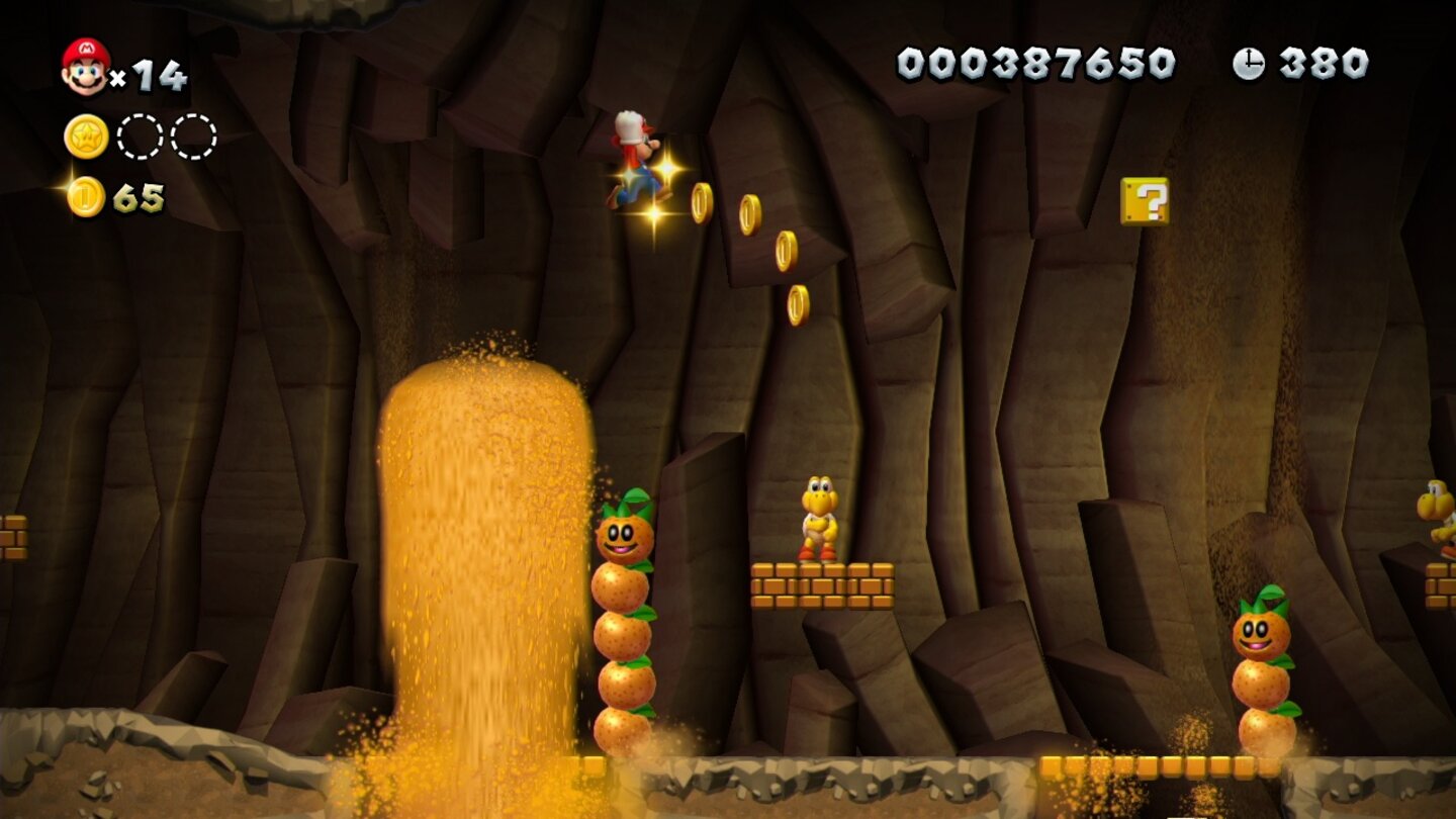 New Super Mario Bros. UEin Sand-Geysir gibt Mario den nötigen Schwung für einen hohen Sprung.