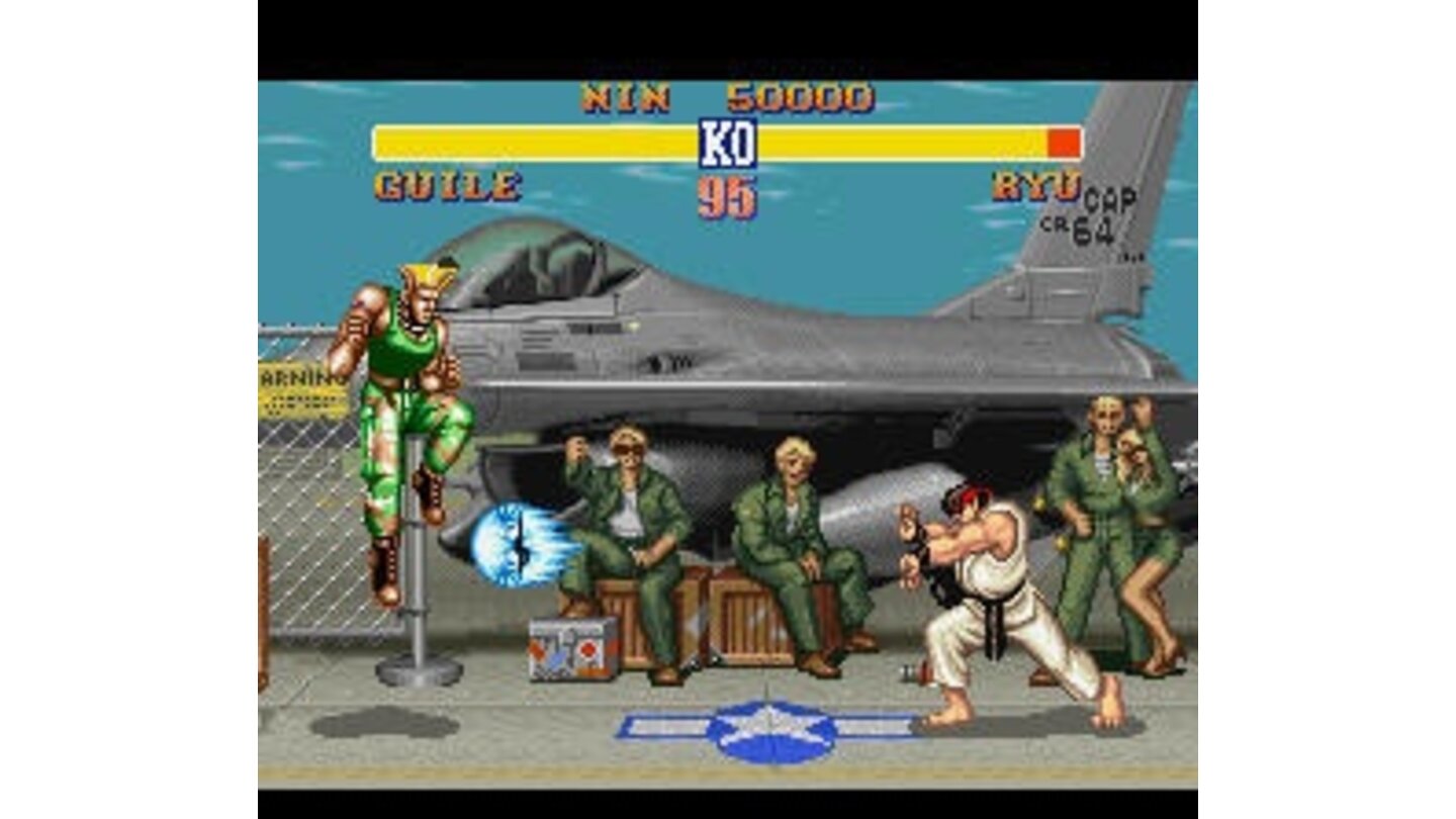 Guile jumps over, what is probably, the most famous projectile ever to be included in a fighting game.