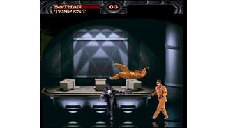 Batman beating up some surprisingly well-dressed thugs