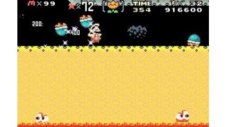 The Super Star Mario in action, smashing some green-shell guys.