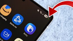 Was bedeutet der grüne oder orange Punkt, der manchmal oben auf dem Handy erscheint?