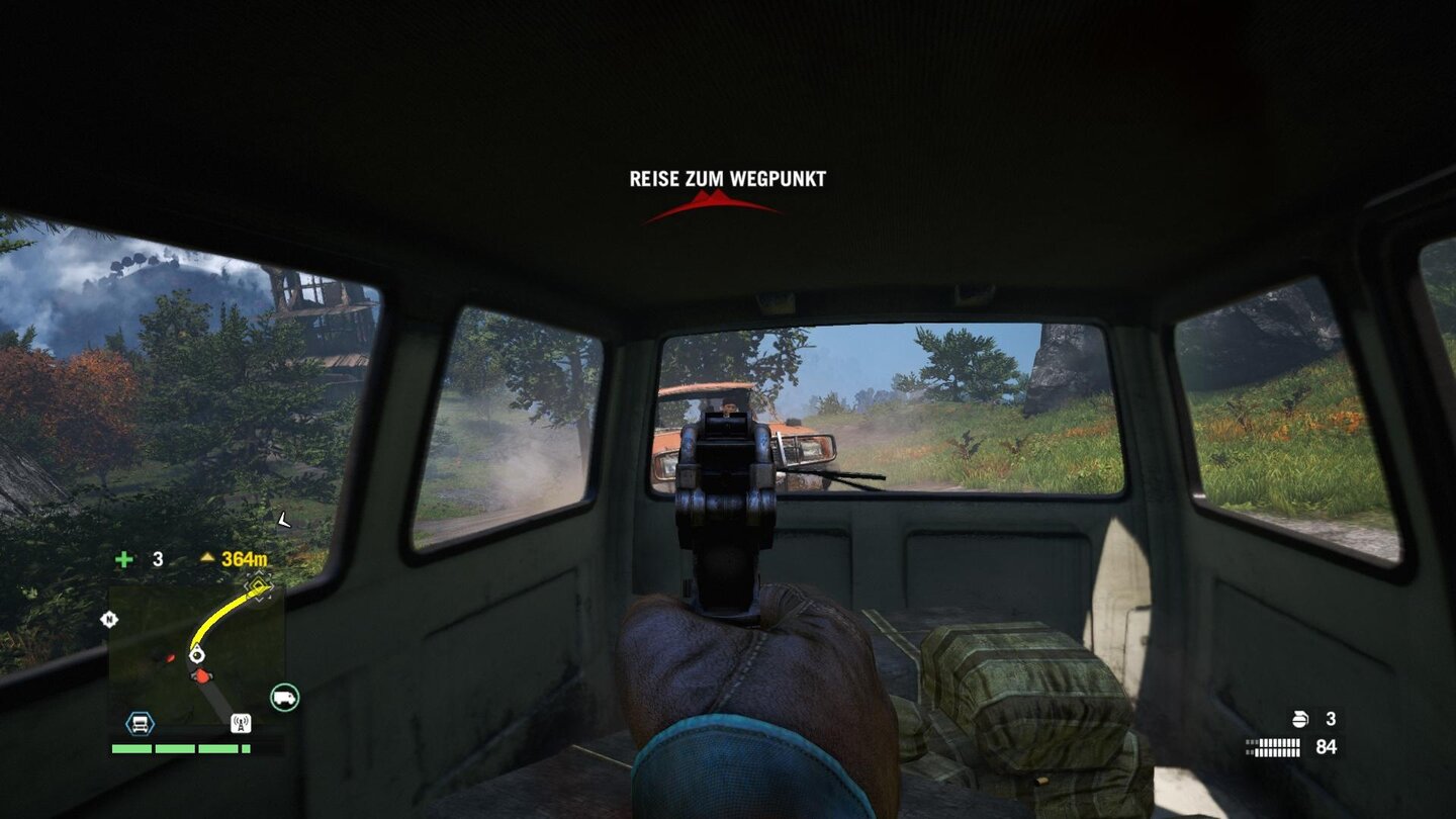 Far Cry 4Dank Fahrhilfe können wir auch aus der Heckscheibe eines fahrenden Autos ballern.