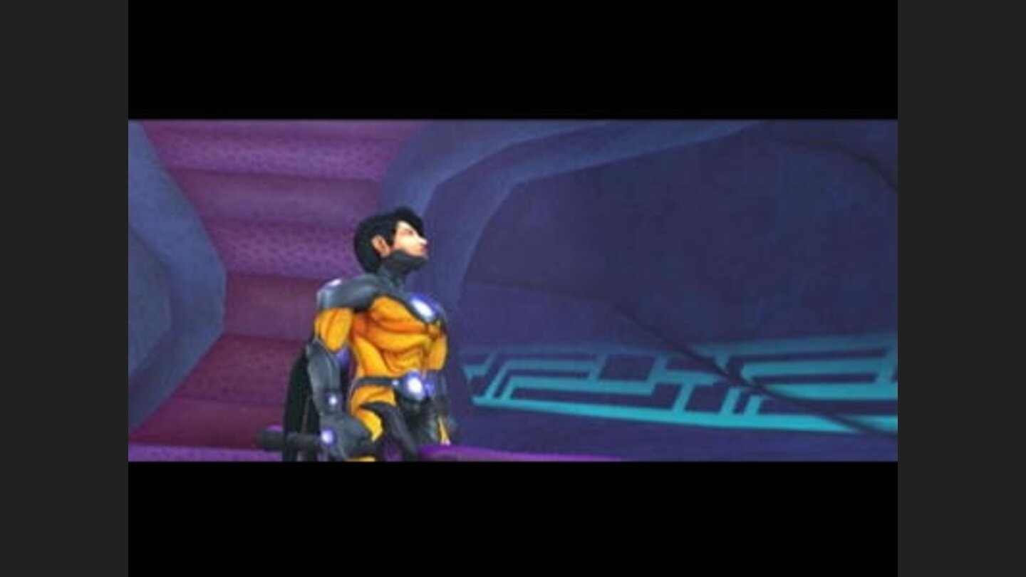 Nevin stands in a dark corridor