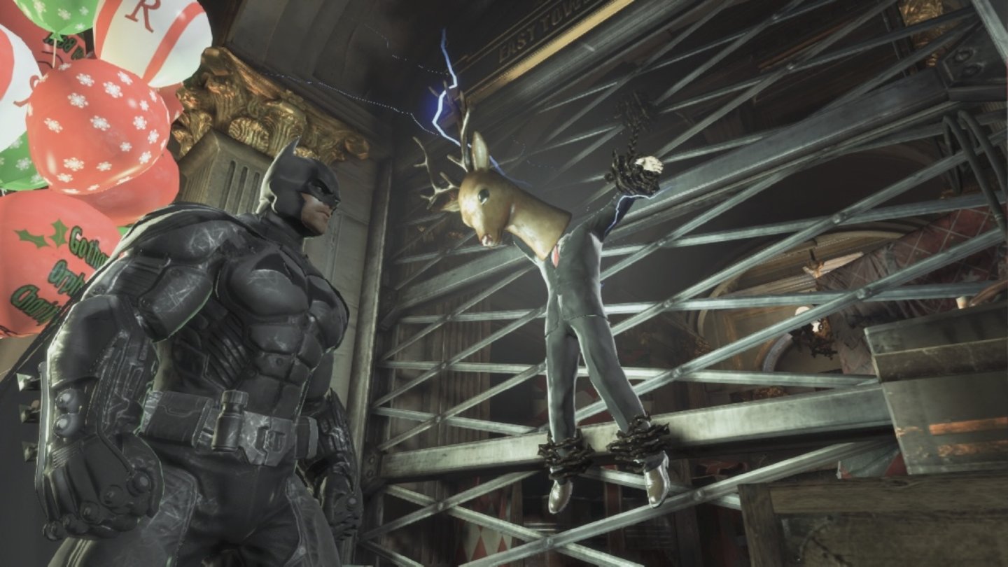 Batman: Arkham OriginsDer Joker gibt sich redliche Mühe, die Schauplätze seiner Verbrechen hübsch weihnachtlich herzurichten.