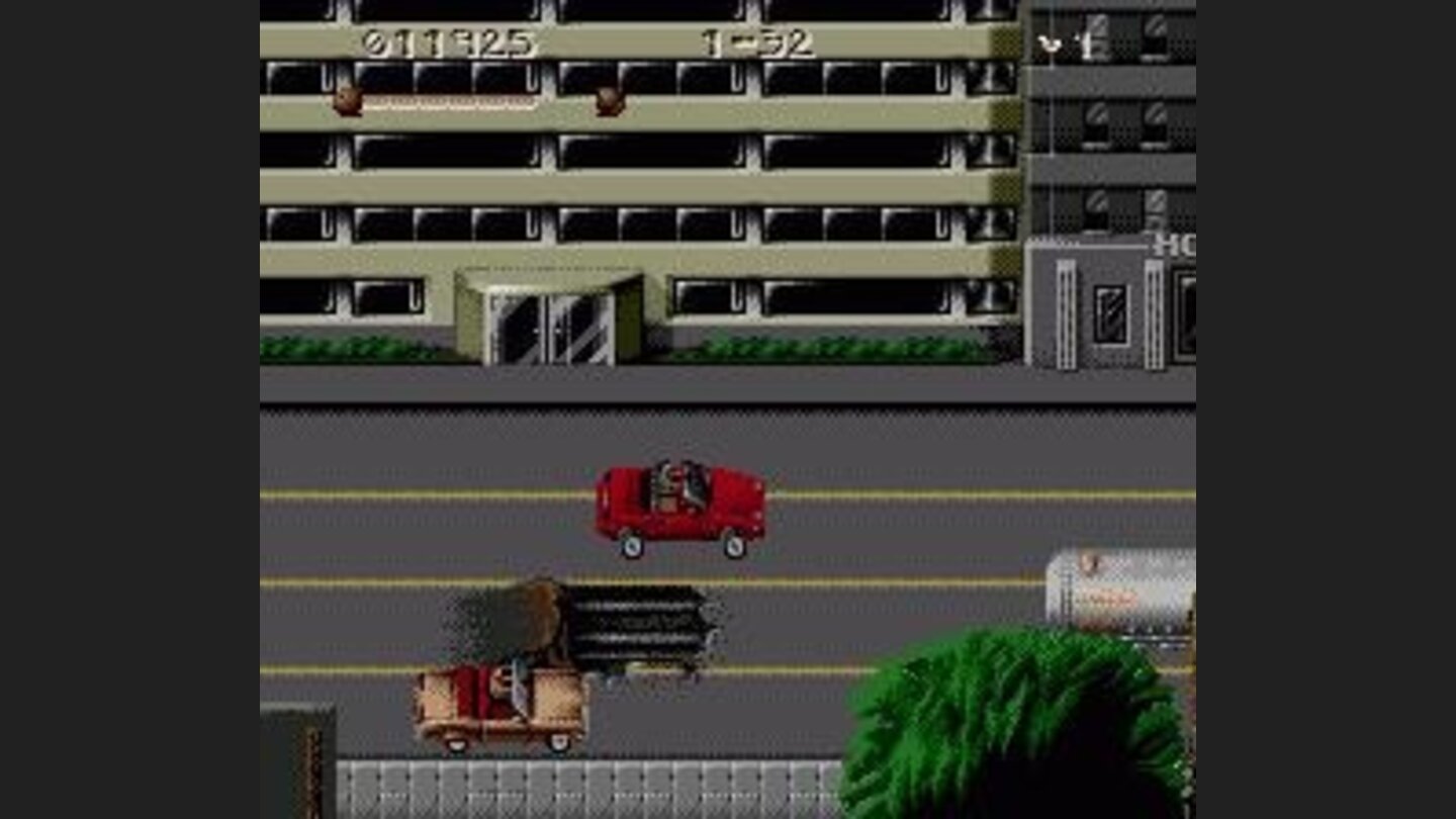 Driving sequence. Slater is driving the brown car near the bottom of the screen.