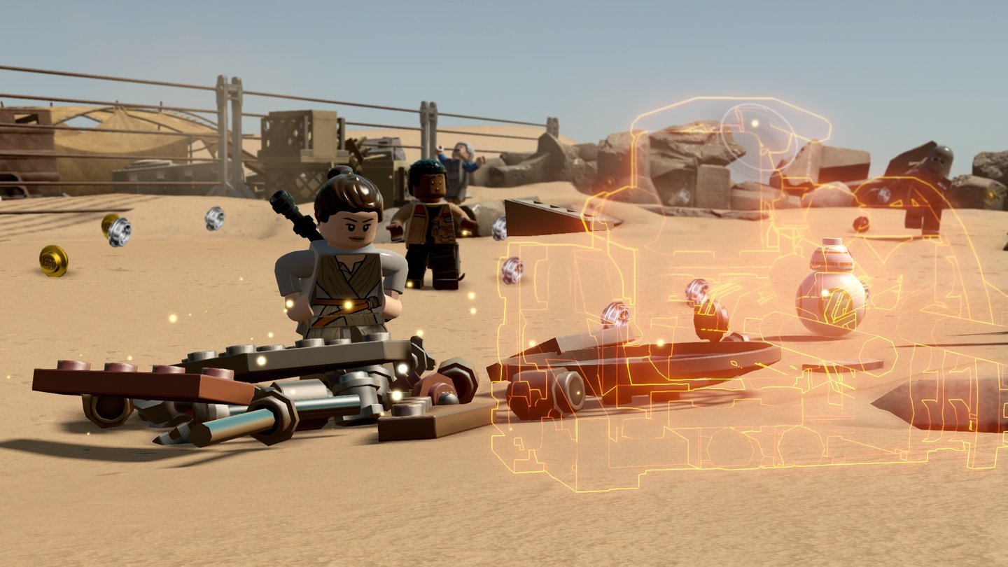Lego Star Wars: Das Erwachen der MachtDas neue Multi-Build-System in Aktion: Orange glühende Silhouetten zeigen an, welche verschiedenen Konstrukte mit den herumliegenden Steinchen gebaut werden können.