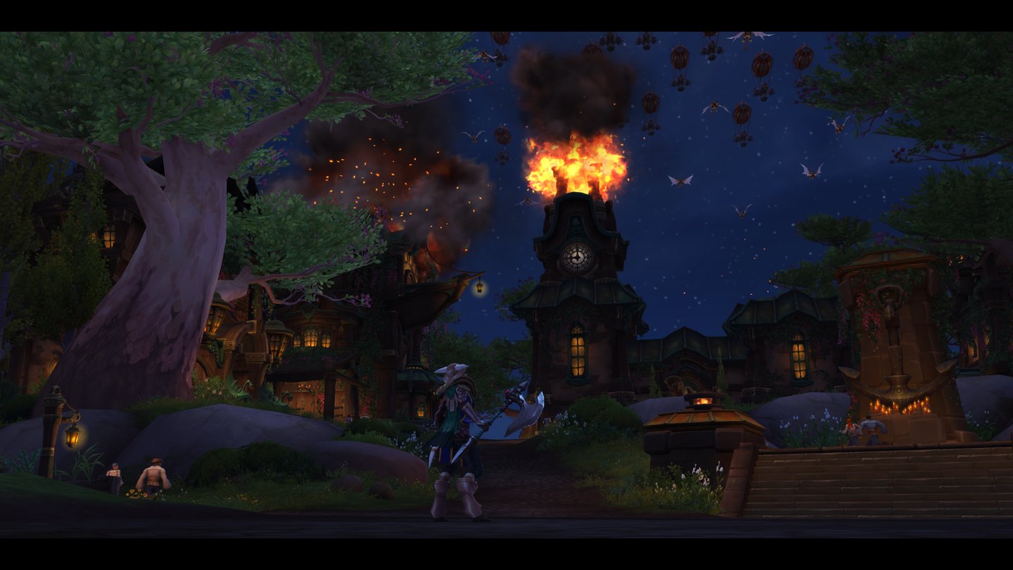 World of Warcraft: Battle for AzerothBeim Questen durch die Gebiete gibt es immer wieder Zwischensequenzen. Hier erleben wir bei Nacht einen Angriff der Horde auf das Sturmsangtal, Das Rathaus steht in Flammen und am Himmel tauchen Goblin-Zeppeline mit Hordetruppen auf.