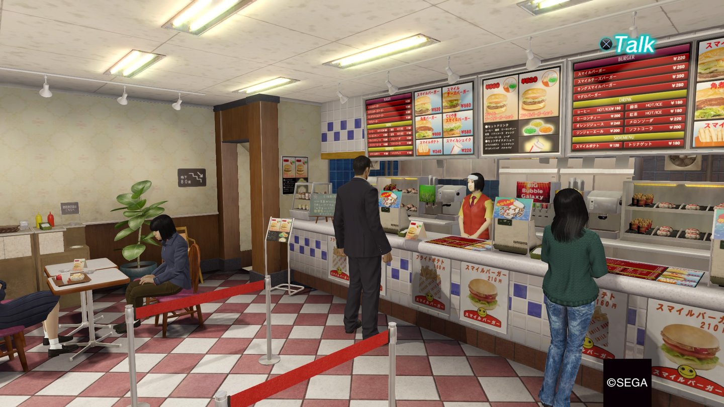 Yakuza ZeroUm Gesundheit wiederherzustellen, gönnt sich Kiryu einen Burger.