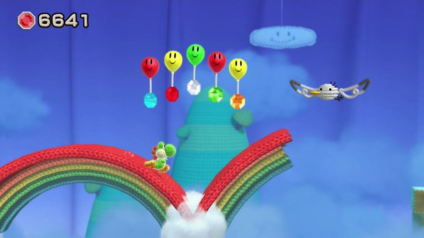 Yoshis Woolly WorldManche Untergründe, wie dieser Regenbogen, stricken sich erst, wenn wir fast schon dran vorbei sind. Da ist eine schnelle Reaktion gefragt.