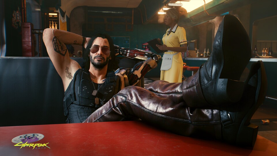 Füße hoch im Spiel: In Cyberpunk 2077 spielt Keanu Reeves als Johnny Silverhand eine Hauptrolle.
