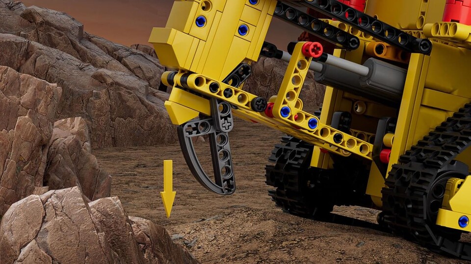 Mit dem Reißzahn kann der Bulldozer den Erdboden aufbrechen, um ihn danach zu verschieben.
