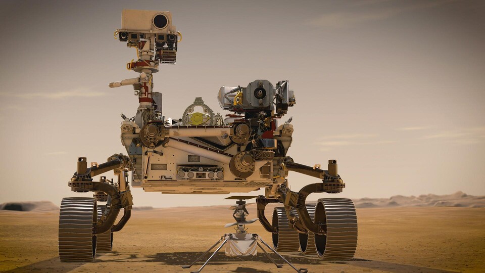 Jede Pionierleistung startet einmal klein - in diesem Fall wortwörtlich. Könnt ihr den Helikopter Ingenuity in der Grafik unter dem großen Rover erkennen? Der Rover Perseverance trug das kleine Fluggerät zum Schutz bei der Landung unter seinem Bauch und setzte ihn anschließend auf dem Marsboden ab. (Quelle: NASAJPL-Caltech)