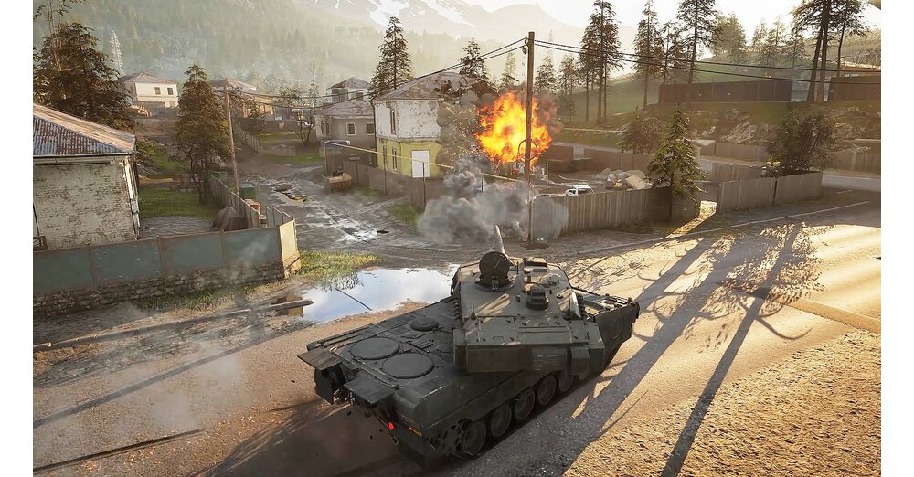 WARDOGS tank moving through a village during combat