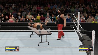 WWE 2K16Nein, das ist kein Nickerchen im Ring: Bray Wyatt will Batista durch den Tisch prügeln.
