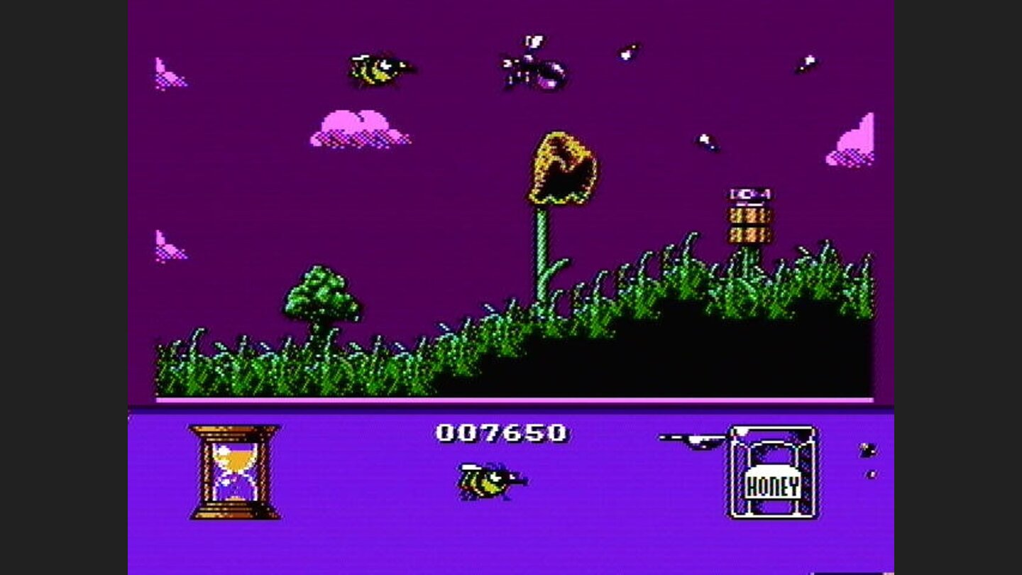 A lawn sprinkler and a bug are in the way