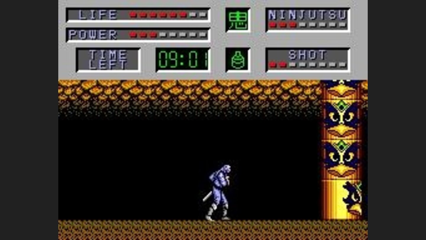 A totem with moving faces on it