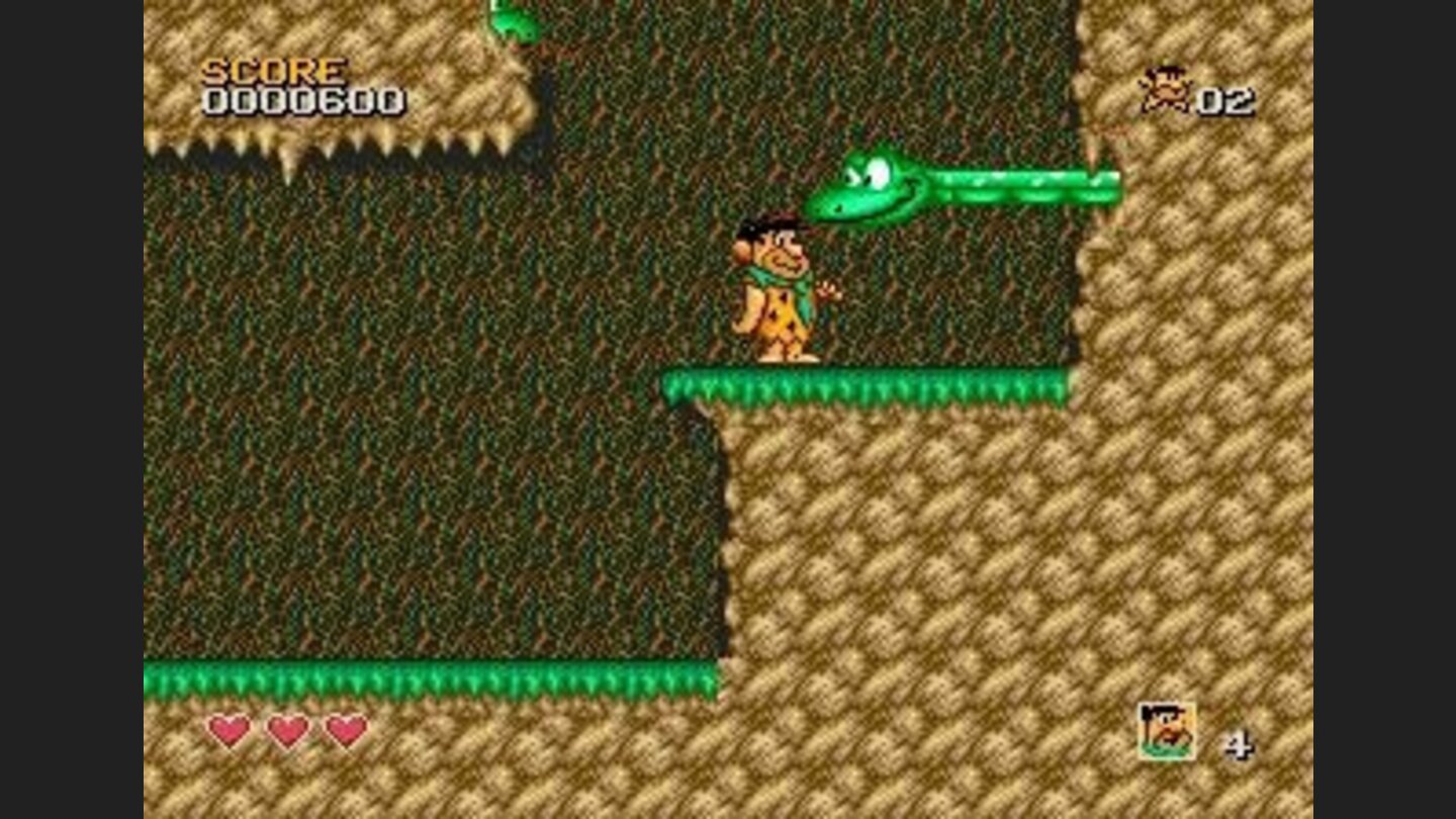 You should hit those green snakes on the head: the will be shocked and youll be able to jump over them unharmed