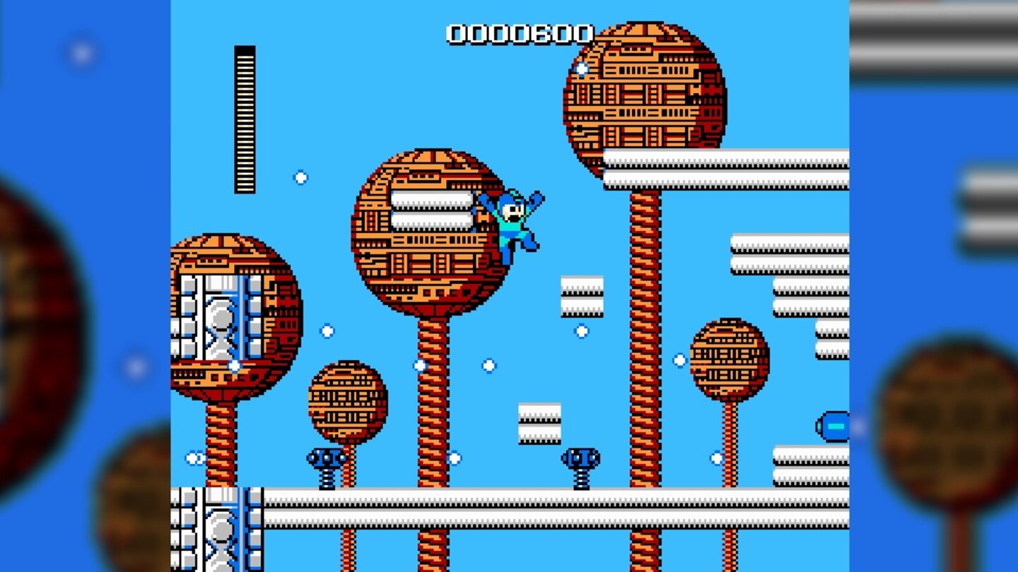 Mega ManUm den vielen Projektilen auszuweichen, helfen beherzte Sprünge. Nur gut, dass man den Helden in der Luft noch steuern kann.