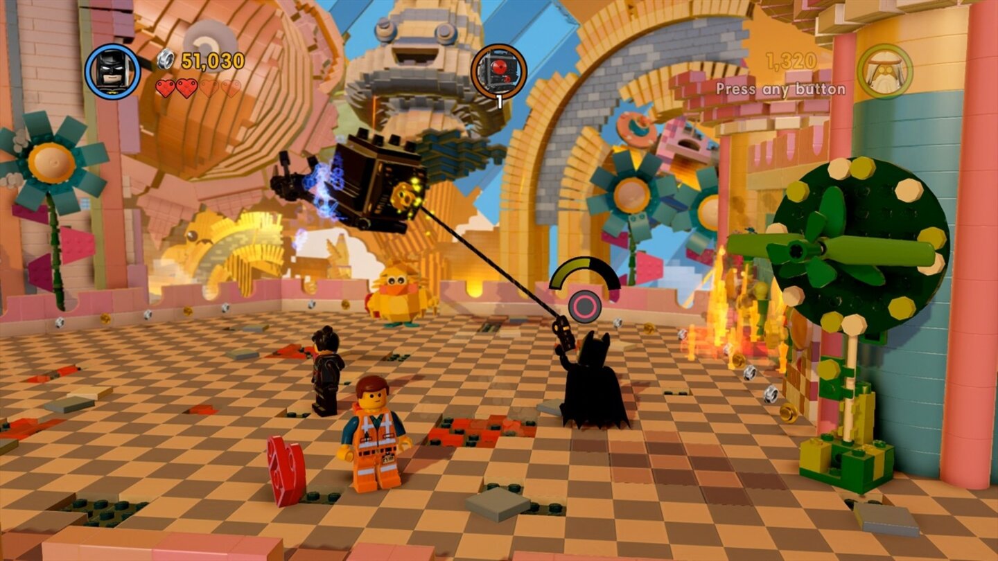 The LEGO Movie VideogameMit seinem Greifhaken holt Batman einen Flugroboter aus der Luft. Immer wieder müssen wir die Talente einzelner Figuren einsetzen, um weiter zu kommen.