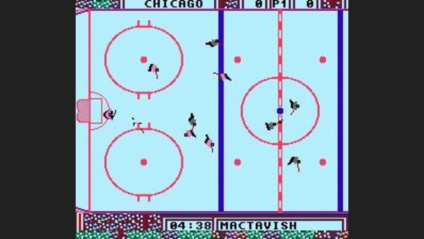 MacTavish has the puck