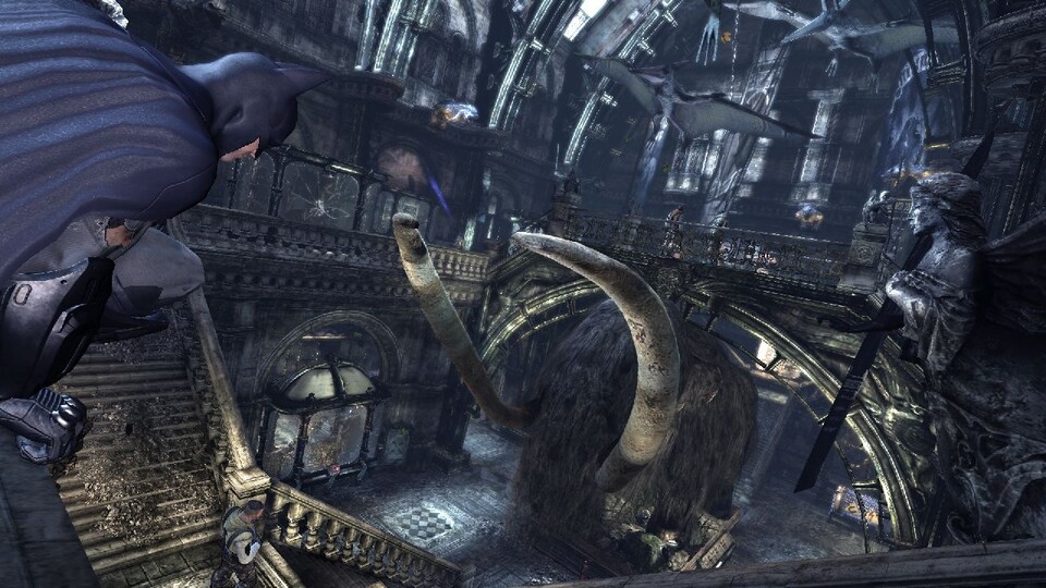 Im heruntergekommenen Museum von Arkham City schleicht Batman zwischen Exponaten wie diesem Mammut umher.