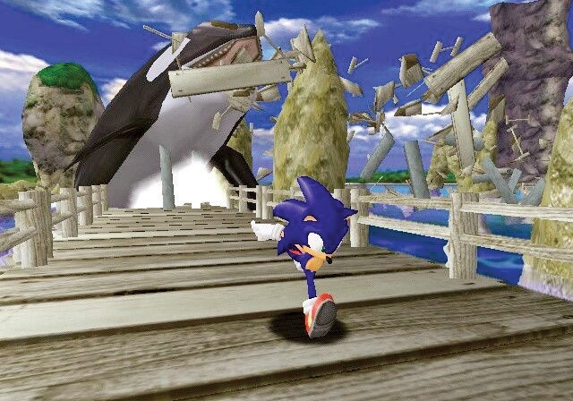Free Willly bricht gegen Ende des ersten Levels aus dem Wasser und zerstört die Holzbrücke, auf der unser Held Sonic entlang läuft. (Screen: GAMECUBE)