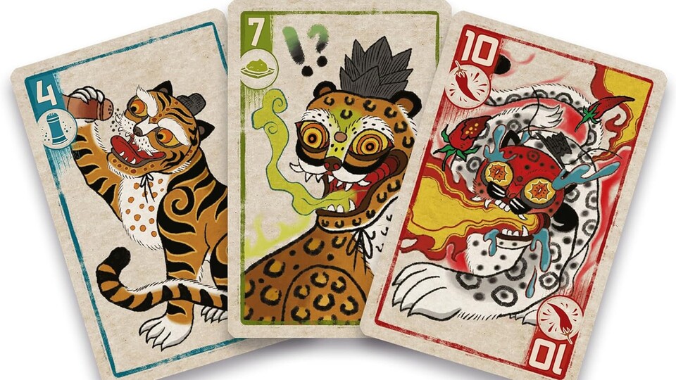 Auf den Spielkarten findet ihr Illustrationen im asiatischen Zeichenstil von coolen Raubkatzen, die scharfe Dinge essen!