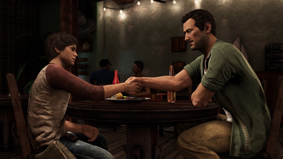 Eine Szene aus dem Spiel Uncharted 3 zeigt den jungen Nathan Drake mit Sully. 